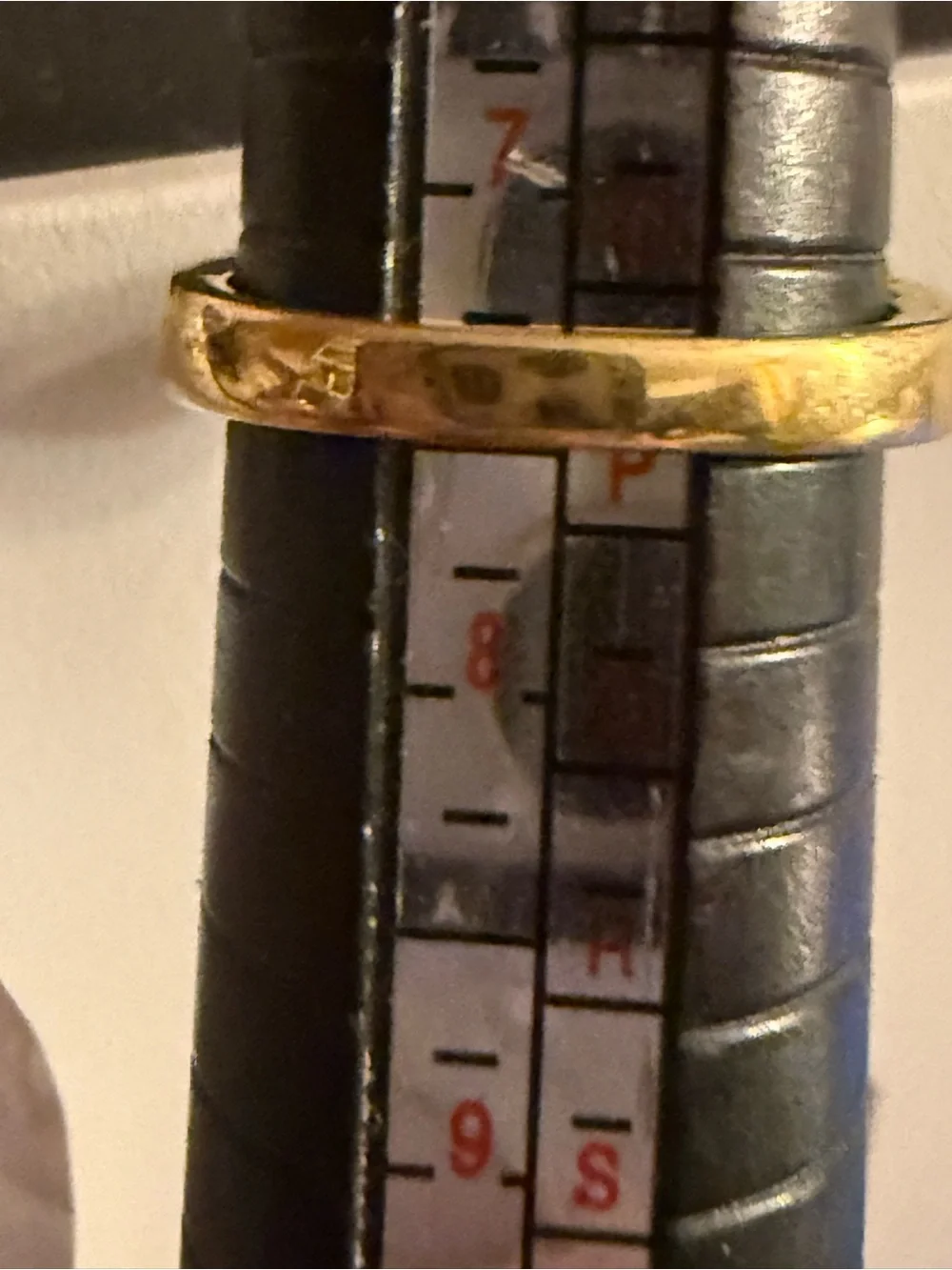Gold tone Ring with Clear Round Center Stone and Baguette Accents
